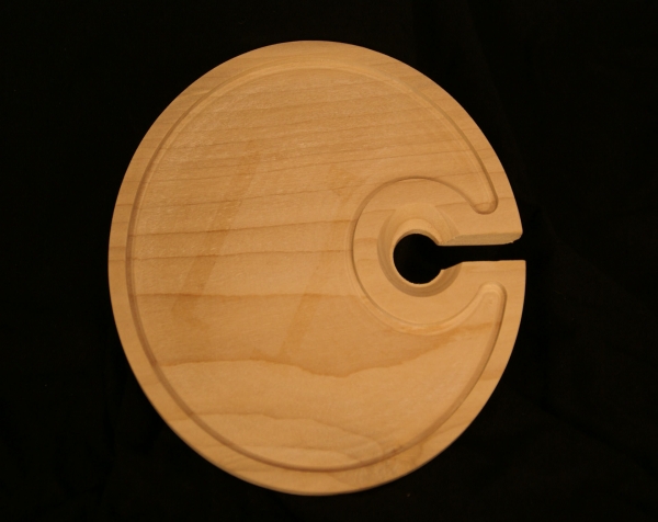 One wooden plate with a cut out for a cup holder. CNC routed